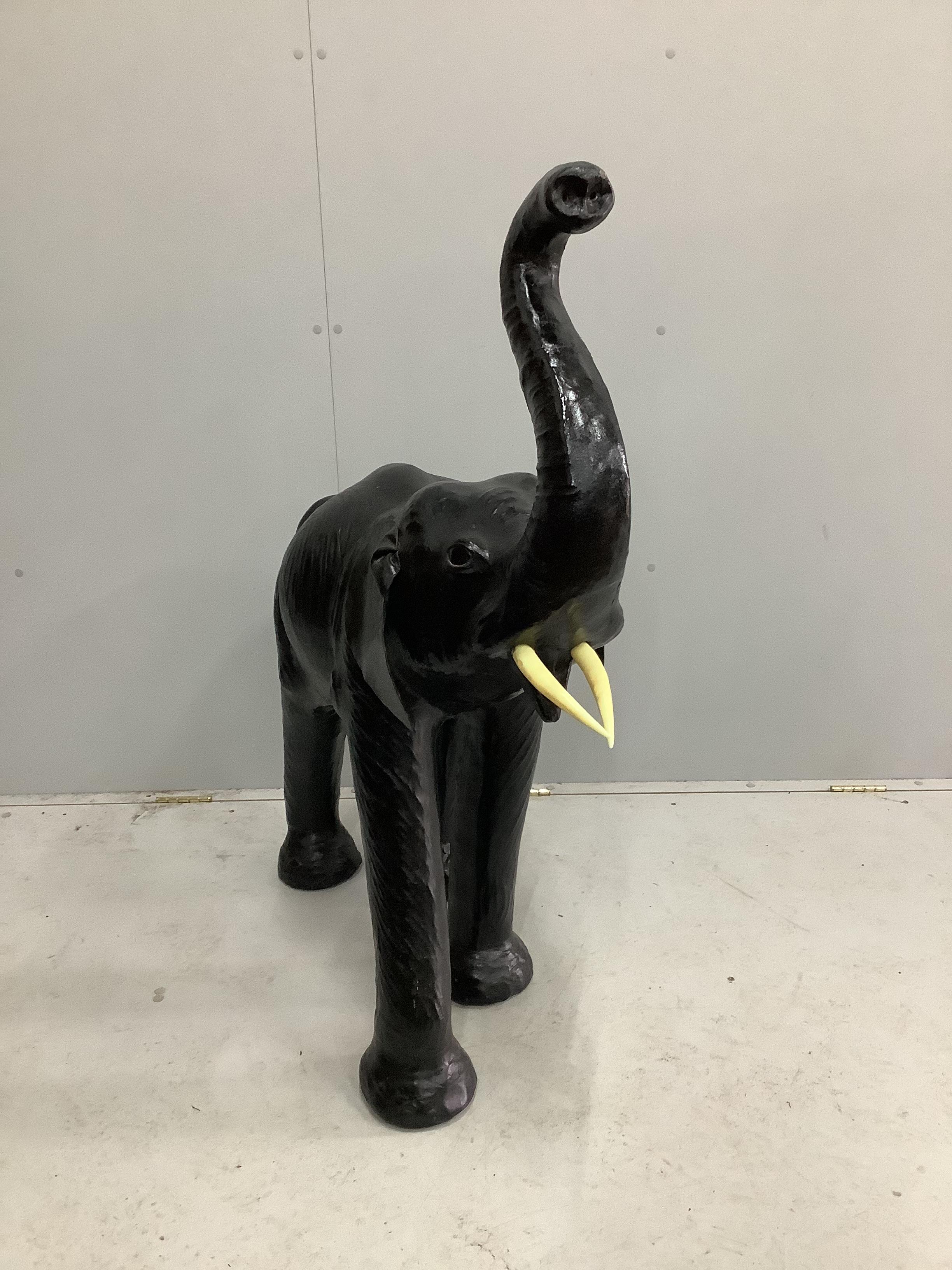 A large black leather covered model of an elephant, height 114cm